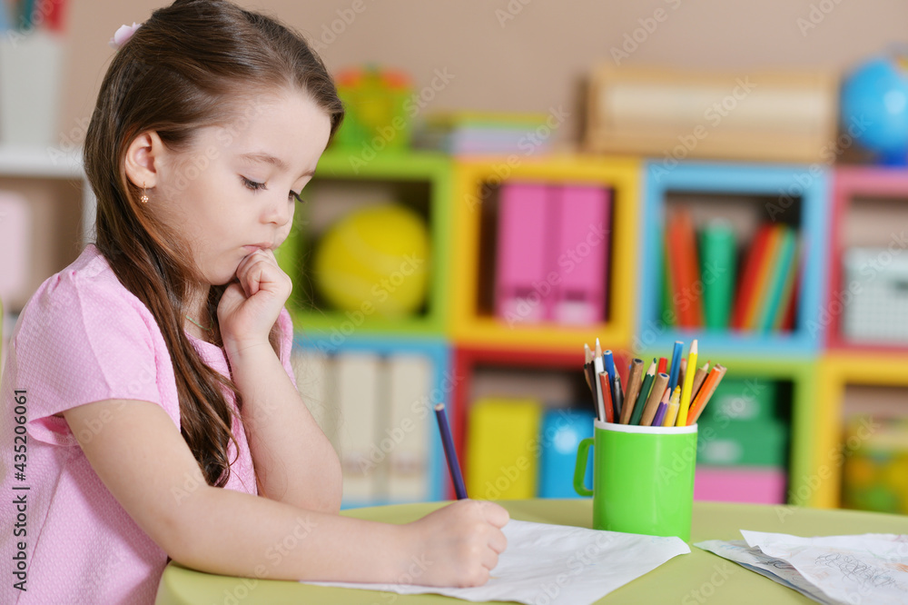 Cute little girl in pink shirt drawing Cute little girl in pink shirt drawing