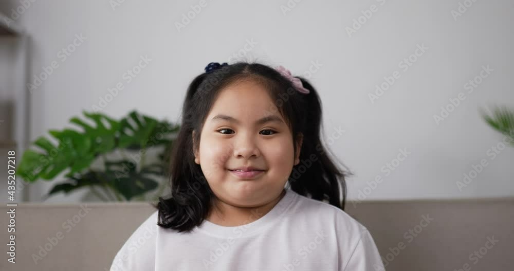 Little girl looking at camera and smile with happy Little girl looking at camera and smile with happy