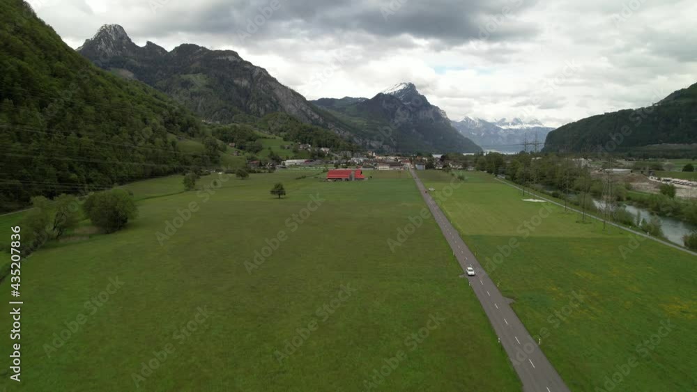 Establishing shot of a wonderful mountain lake panorama in Switzerland, aerial. Establishing shot of a wonderful mountain lake panorama in Switzerland, aerial.