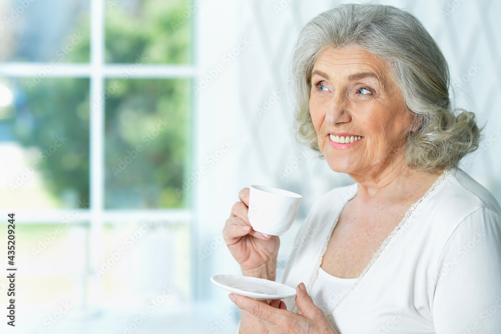 beautiful smiling senior woman drinking tea beautiful smiling senior woman drinking tea