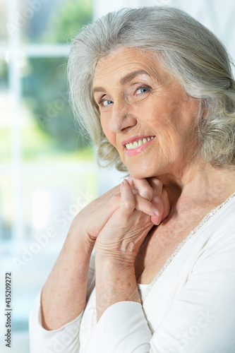  close up portrait of beautiful smiling senior woman
