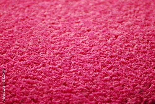 Close up of pink pile carpet