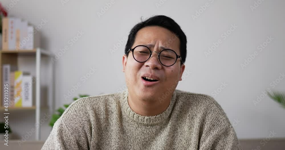 Cheerful man laugh in good mood and looking at camera Cheerful man laugh in good mood and looking at camera