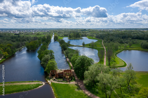 A panoramic view from a height of the ponds and the Landscape Park in Peterhof  the meadow garden  walking paths  the destroyed pavilion.