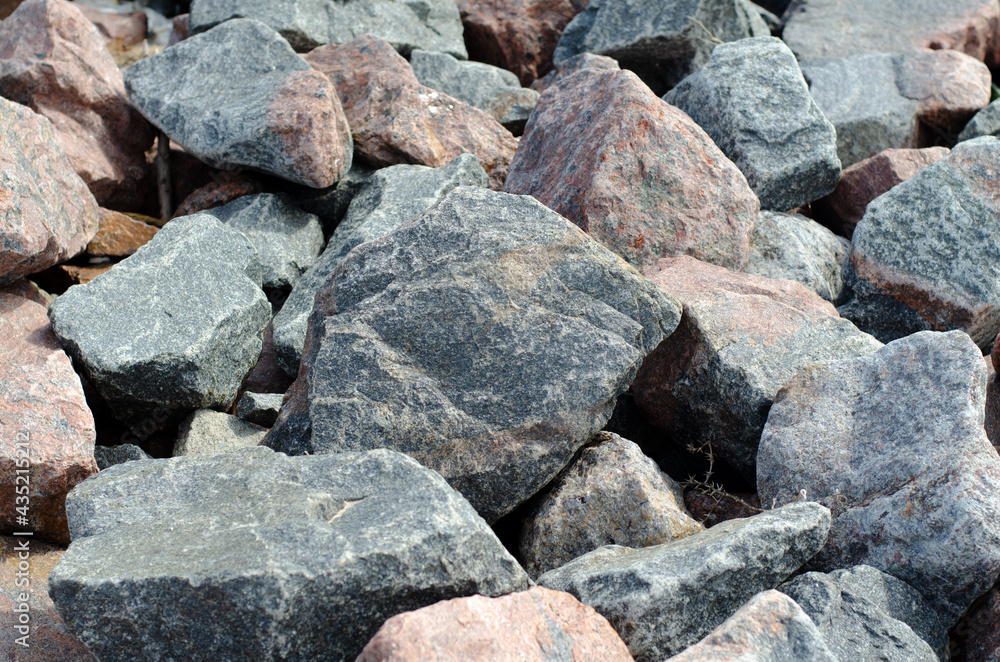 Granite structure. Large stones. Large boulders. Rock. Breakwater. Granite structure. Large stones. Large boulders. Rock. Breakwater.