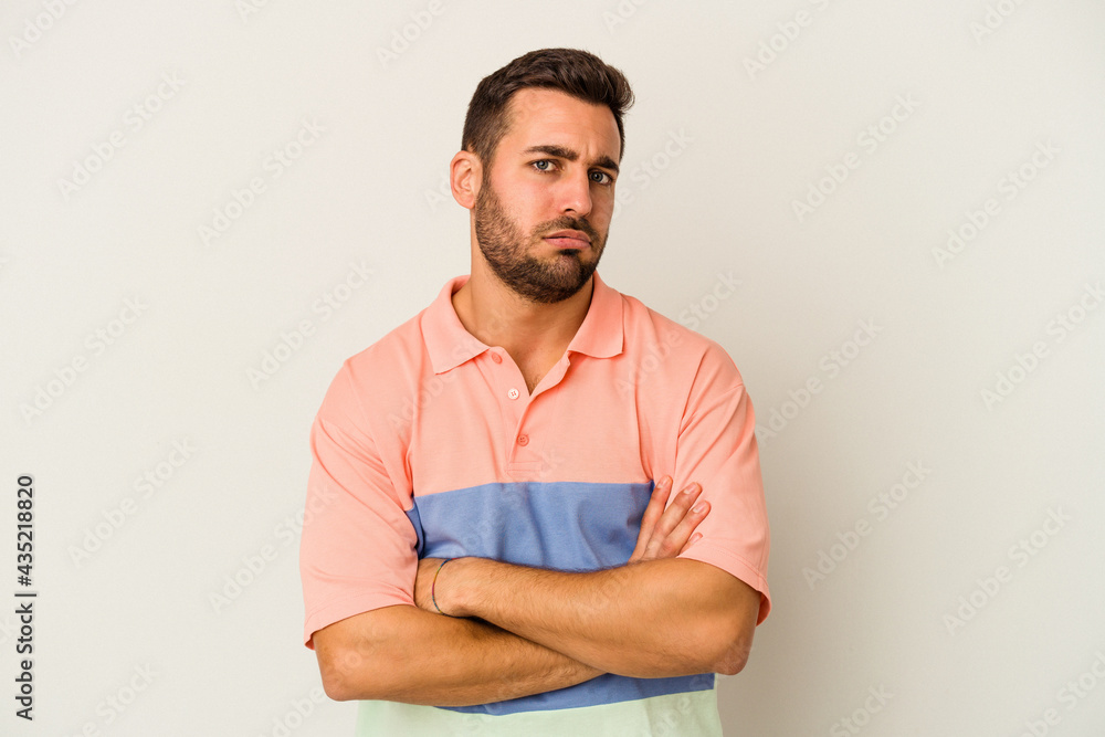 Young caucasian man isolated on white background who is bored, fatigued and need a relax day. Young caucasian man isolated on white background who is bored, fatigued and need a relax day.