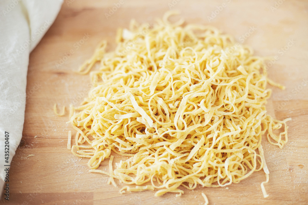 The process of cooking homemade noodles, spaghetti, pasta.