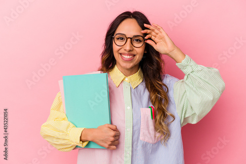 Young student mexican woman isolated on pink background excited keeping ok gesture on eye.