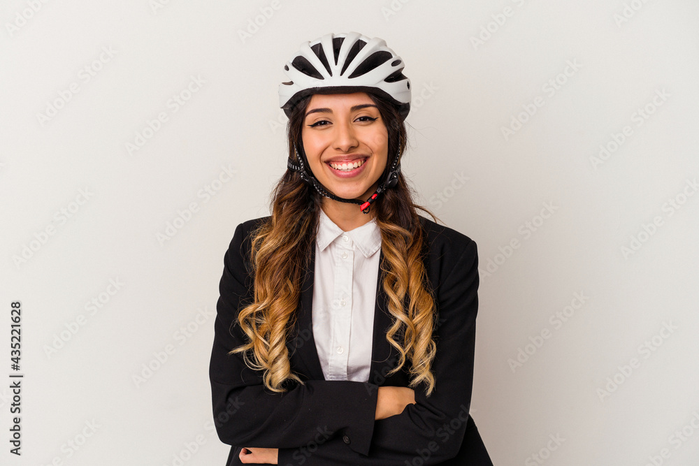 Young mexican woman riding a bicycle to work isolated on white background laughing and having fun. Young mexican woman riding a bicycle to work isolated on white background laughing and having fun.