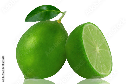 One green lemon fruit with leaf and a half isolated on white background
