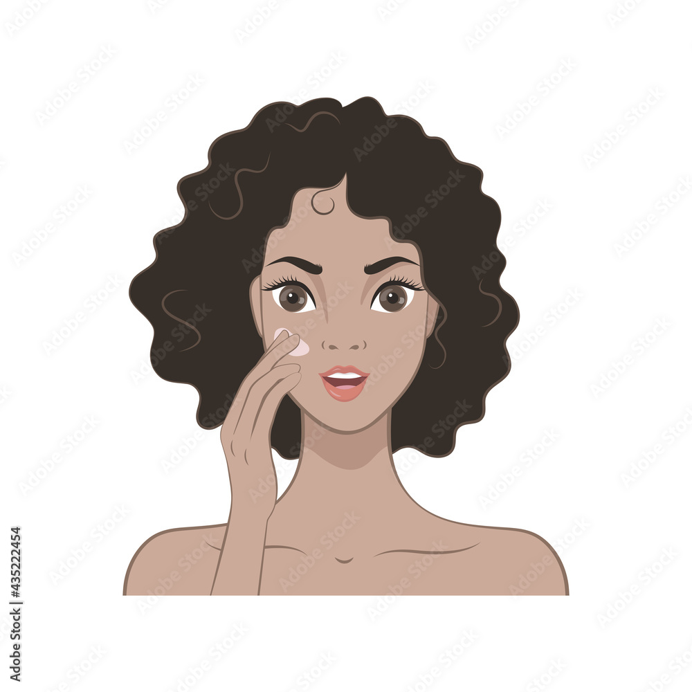 A beautiful girl with dark curly hair applies a moisturizer to her face. Skin care A beautiful girl with dark curly hair applies a moisturizer to her face. Skin care