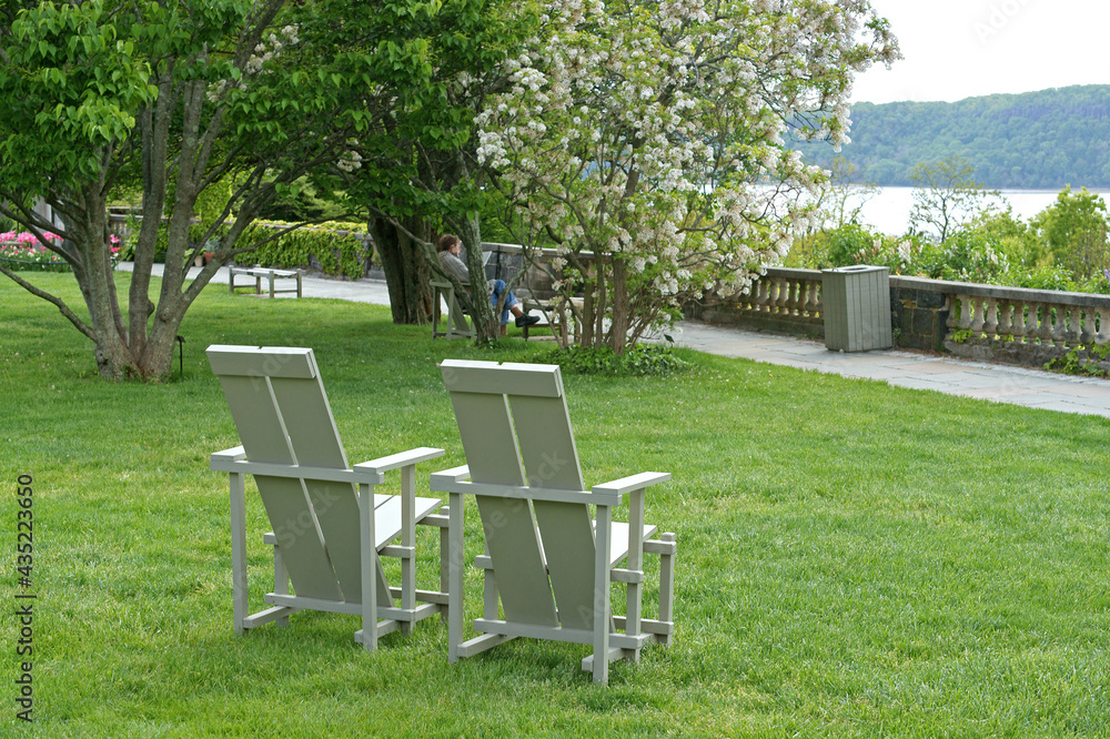 Great Lawn with chairs and magnificent views of Hudson River. Wave Hill in Hudson Hill of Riverdale in Bronx, New York City Great Lawn with chairs and magnificent views of Hudson River. Wave Hill in Hudson Hill of Riverdale in Bronx, New York City