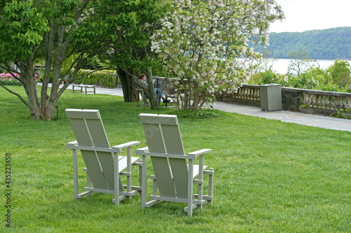 Great Lawn with chairs and magnificent views of Hudson River.  Wave Hill in Hudson Hill of Riverdale in Bronx, New York City