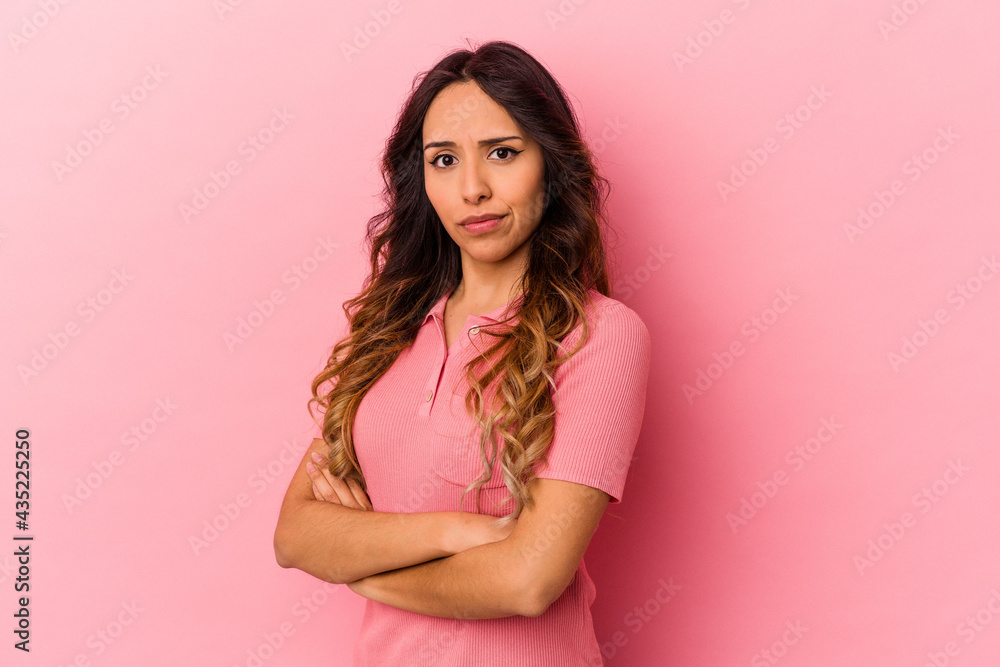 Young mexican woman isolated on pink background unhappy looking in camera with sarcastic expression. Young mexican woman isolated on pink background unhappy looking in camera with sarcastic expression.