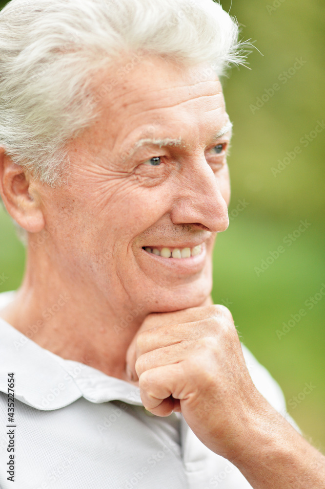 happy senior man thinking in park happy senior man thinking in park