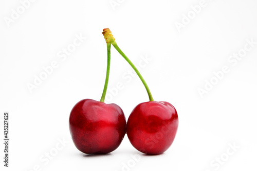 Cherry isolated. Cherry on white. Cherries. With clipping path. Red cherries on a white background full of vitamins and tasty flavor, sweet and ideal for eating raw or in desserts.