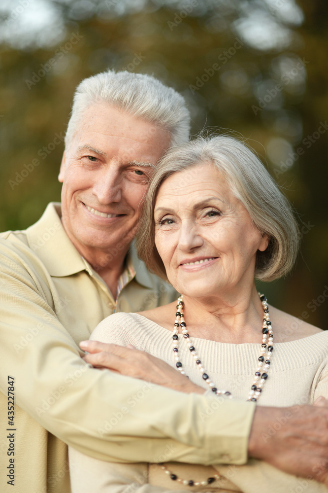 smiling senior couple in autumn park smiling senior couple in autumn park