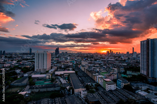 The high angle background of the city view with the secret light of the evening  blurring of night lights  showing the distribution of condominiums  dense homes in the capital community