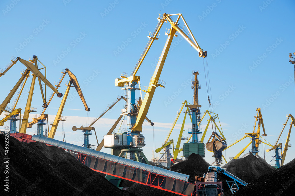 Heaps of coal in the port, Murmansk Commercial Sea Port - Northern Port of the Russian Federation Heaps of coal in the port, Murmansk Commercial Sea Port - Northern Port of the Russian Federation