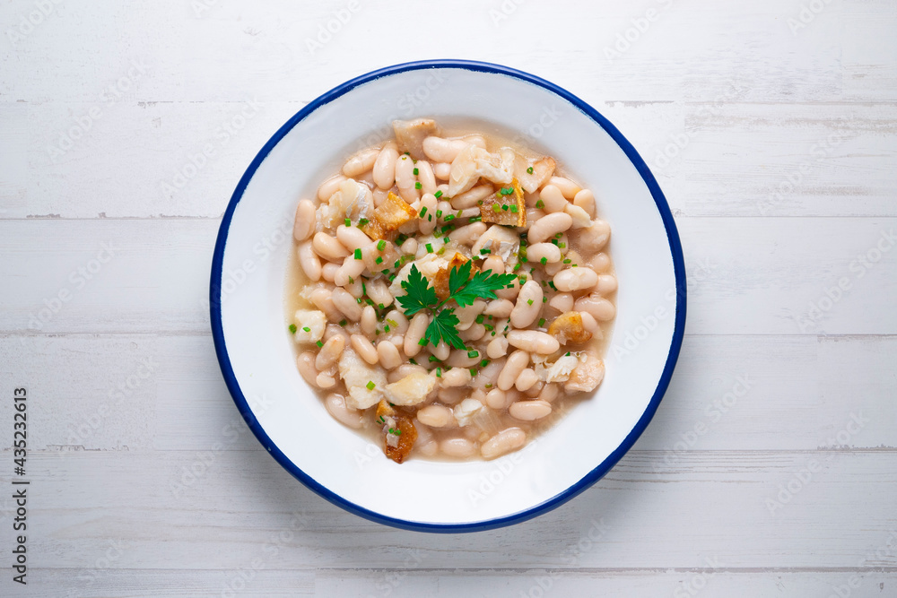 Beans with cod and pork belly. Traditional Spanish recipe. Beans with cod and pork belly. Traditional Spanish recipe.
