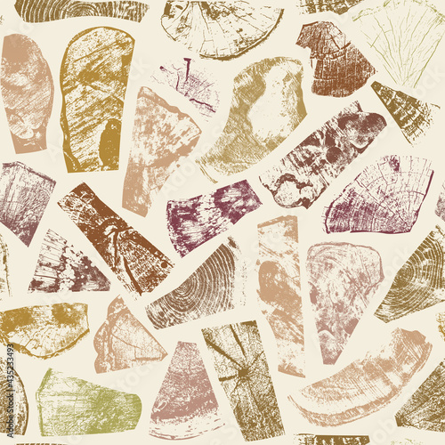 Seamless pattern with wooden imprints of various colors, textures and shapes on a light backdrop. Abstract vector background with wood elements in retro style. Wallpaper, wrapping paper, flooring