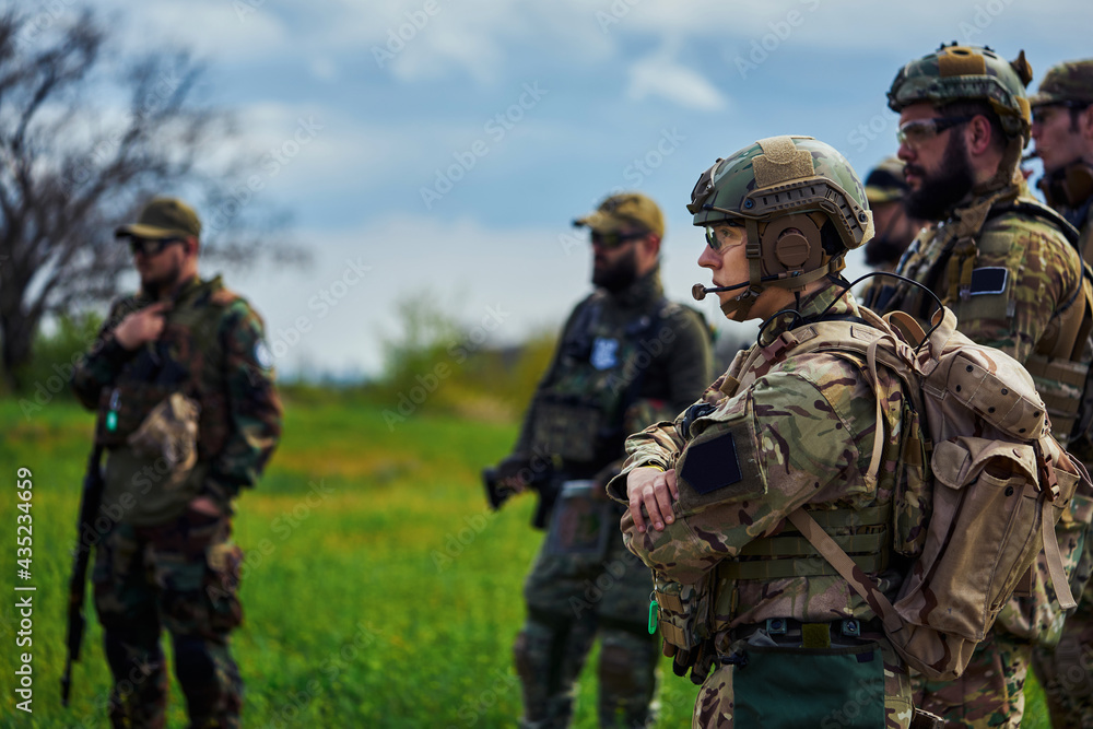 Group of military soldiers in uniform with weapons Group of military soldiers in uniform with weapons