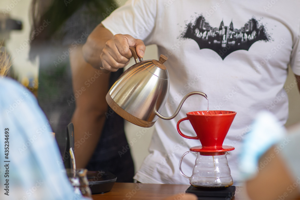 bartender pouring hot water for coffee bartender pouring hot water for coffee