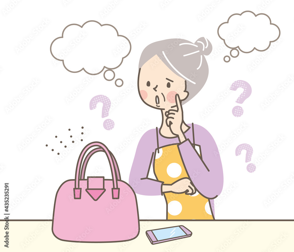 バッグの値段を考えているシニア女性 バッグの値段を考えているシニア女性