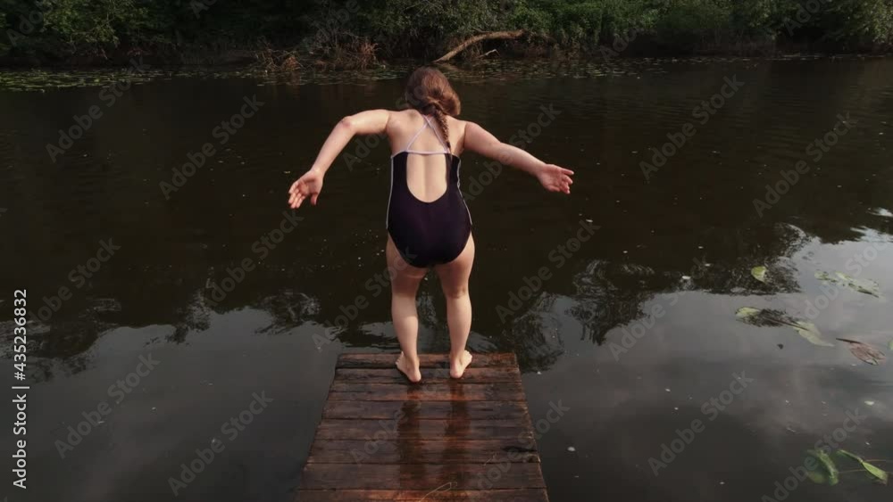 Girl is swimming in river, enjoying summer days. Girl is swimming in river, enjoying summer days.