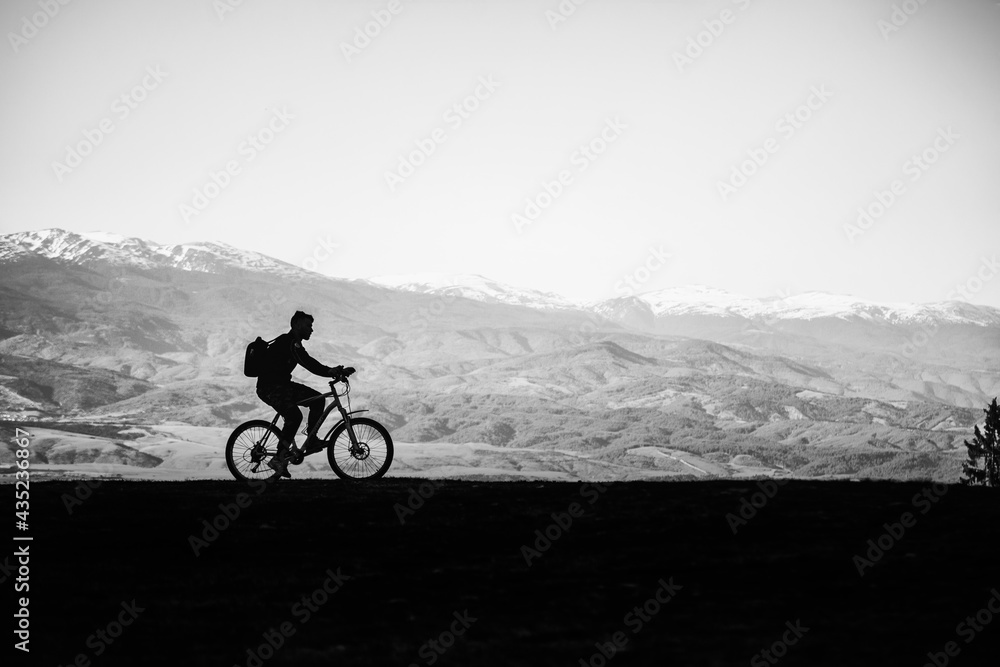 Cyclist man on a background of mountains
