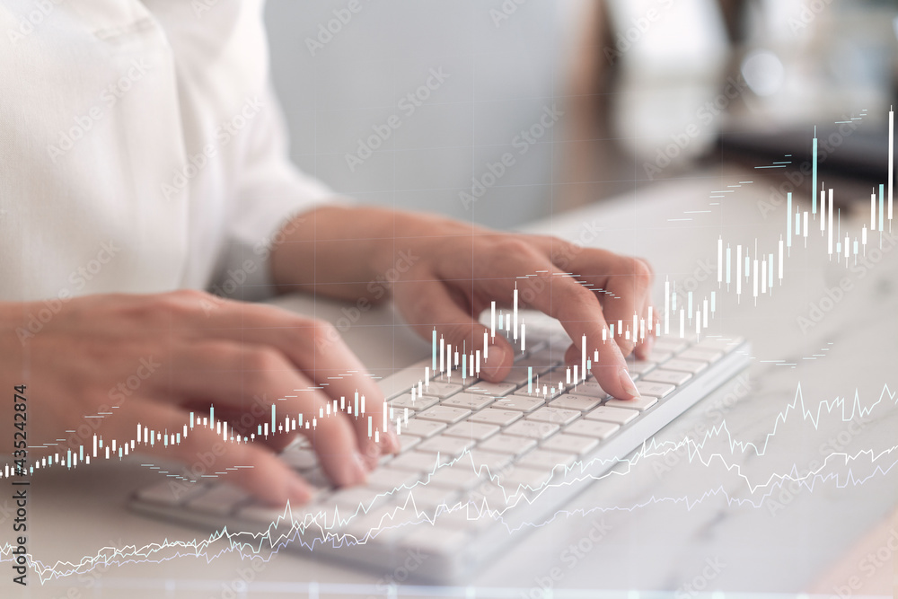 Woman typing the keyboard to research stock market to proceed right investment solutions. Internet trading and wealth management concept. Formal wear. Hologram Forex chart over close up shot. Woman typing the keyboard to research stock market to proceed right investment solutions. Internet trading and wealth management concept. Formal wear. Hologram Forex chart over close up shot.