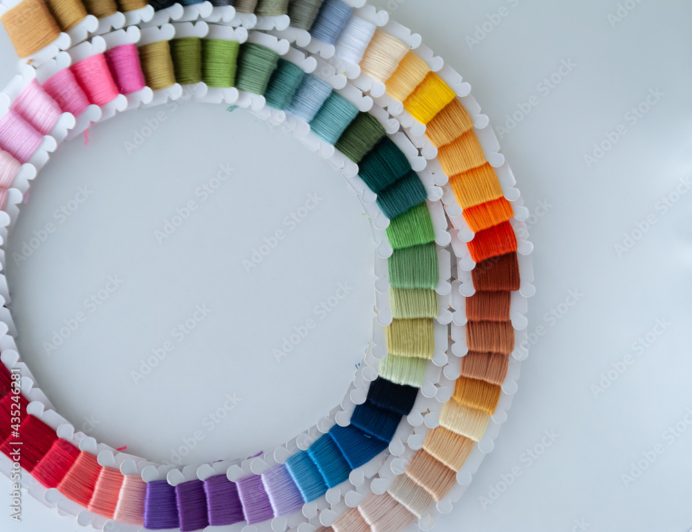 Word DIY world made of colorful bobbins, treads. Do it yourself concept. Sewing, hobby