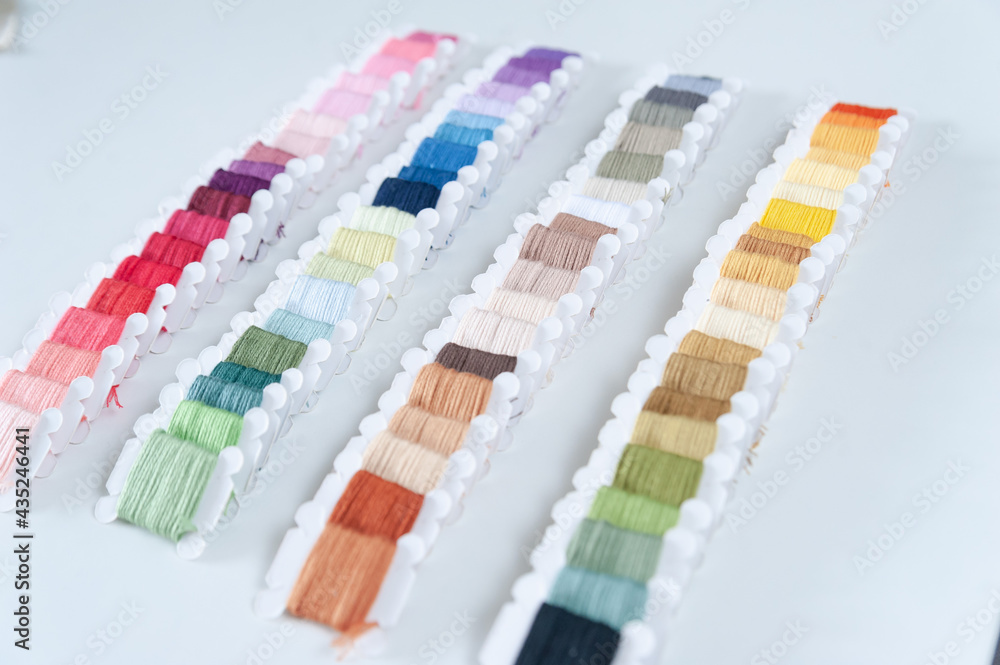 Word DIY world made of colorful bobbins, treads. Do it yourself concept. Sewing, hobby
