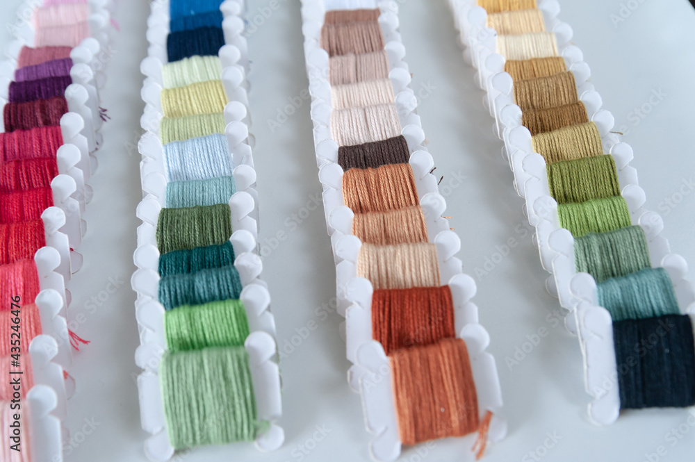 Word DIY world made of colorful bobbins, treads. Do it yourself concept. Sewing, hobby