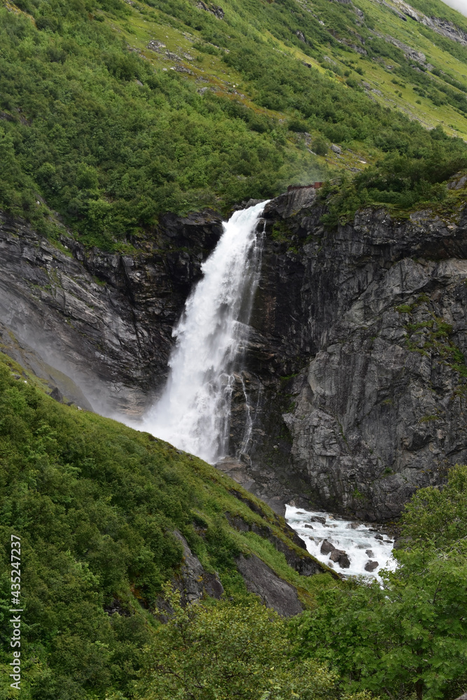 Obraz premium Waterfall, montains and gloomy weather