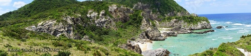 Aerial view of coastal beach and seaside rock from Chishi observation deck in Zamami island, Okinawa, Japan. Panoramic view - 日本 沖縄 座間味島 チシ展望台からの眺望 パノラマ