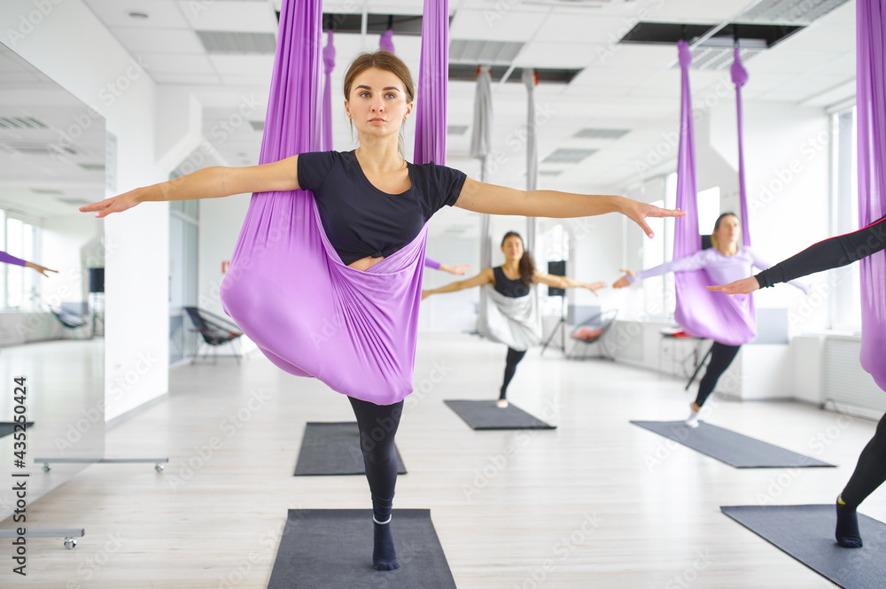Fly yoga, group training with hammocks Fly yoga, group training with hammocks