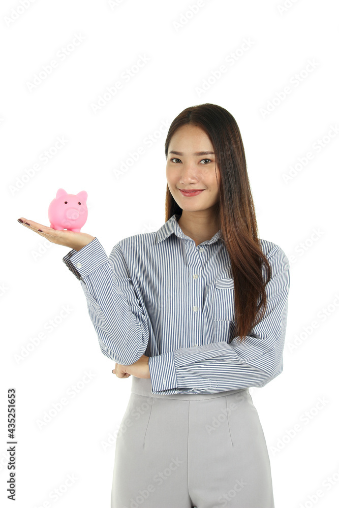 Portrait of young beautiful Asian woman with long dark brown hair standing with pink piggy bank on hand isolated on white background Portrait of young beautiful Asian woman with long dark brown hair standing with pink piggy bank on hand isolated on white background