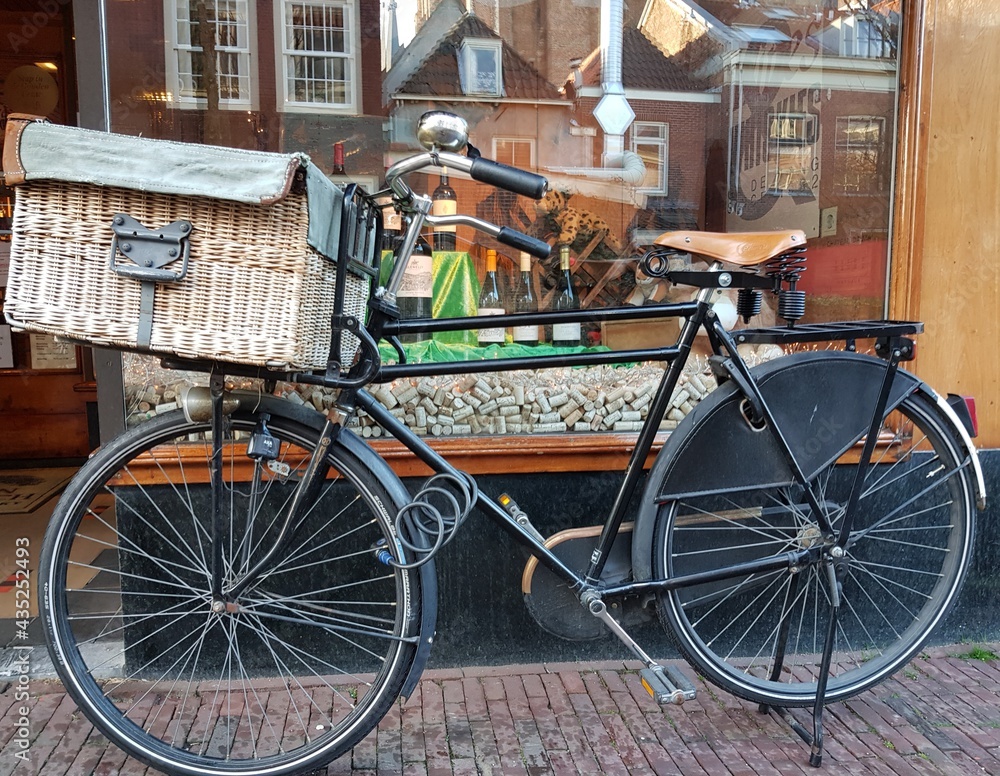 Bakfiets (bakers bicycle) in the street of Delft, the Netherlands.