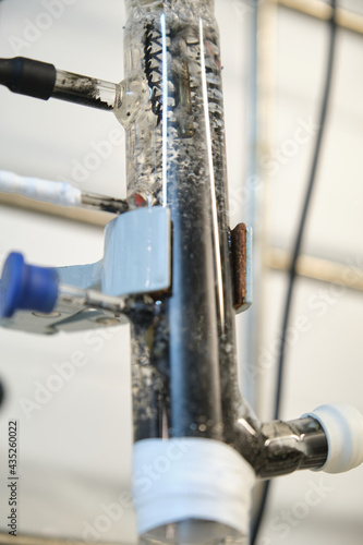 Fluidized Bed Reactor connected to an anode, cathode and reference electrode. Laboratory experiment. photo