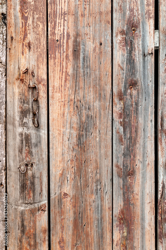 Old wooden background. Old shabby wood planks. A tattered dilapidated fence. Natural creative texture for editing and design.