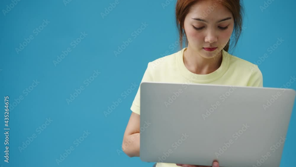 Young girl shopping online with laptop and payment order online isolated over blue background. Copy space for place a text, message for advertisement. Advertising area, mockup promotional content. Young girl shopping online with laptop and payment order online isolated over blue background. Copy space for place a text, message for advertisement. Advertising area, mockup promotional content.