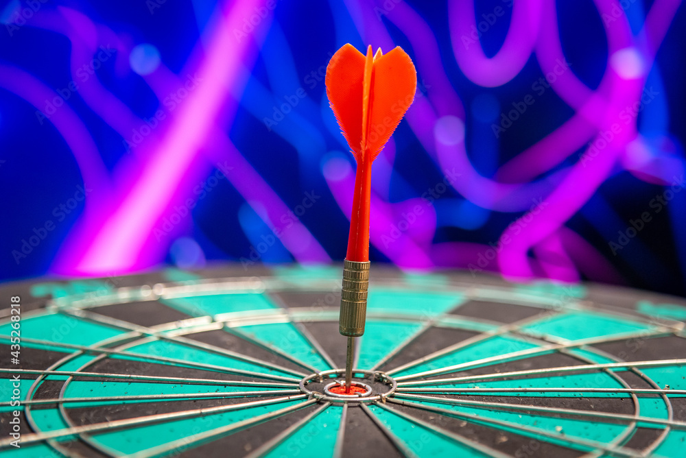 Fototapeta premium Bullseye is a target of business. Dart is an opportunity and Dartboard is the target and goal. So both of that represent a challenge in business marketing as concept.
