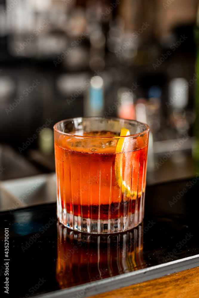 Bartender Hands Making a Perfect Negroni Drink Step by Step Recipe at the bar Bartender Hands Making a Perfect Negroni Drink Step by Step Recipe at the bar