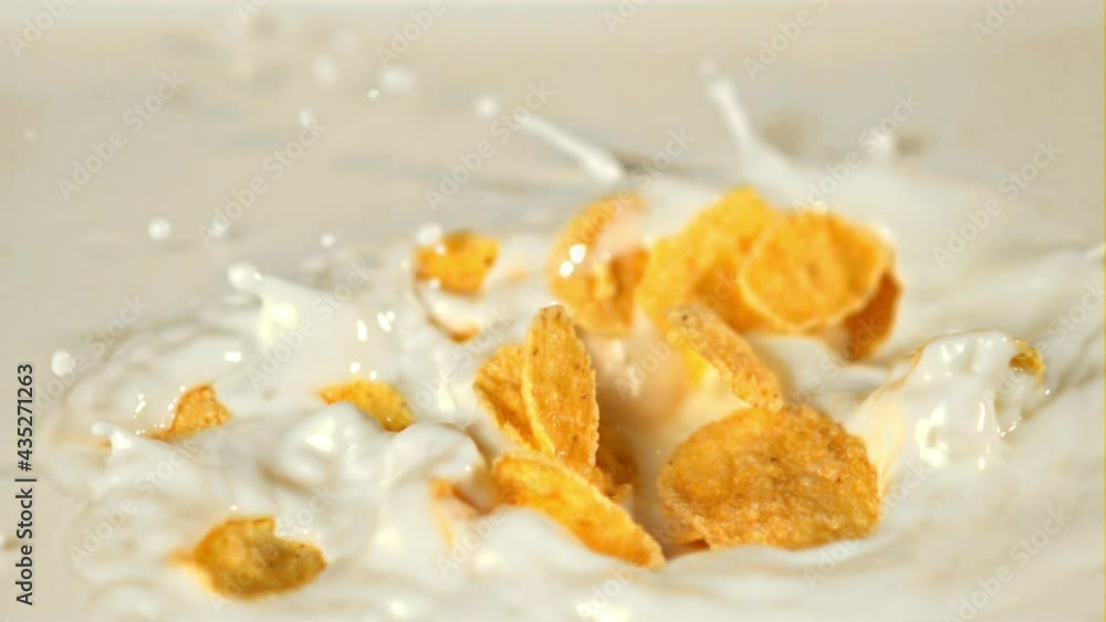 Super slow motion in the milk fall cornflakes with spray.Filmed on a high-speed camera at 1000 fps. High quality FullHD footage Super slow motion in the milk fall cornflakes with spray.Filmed on a high-speed camera at 1000 fps. High quality FullHD footage