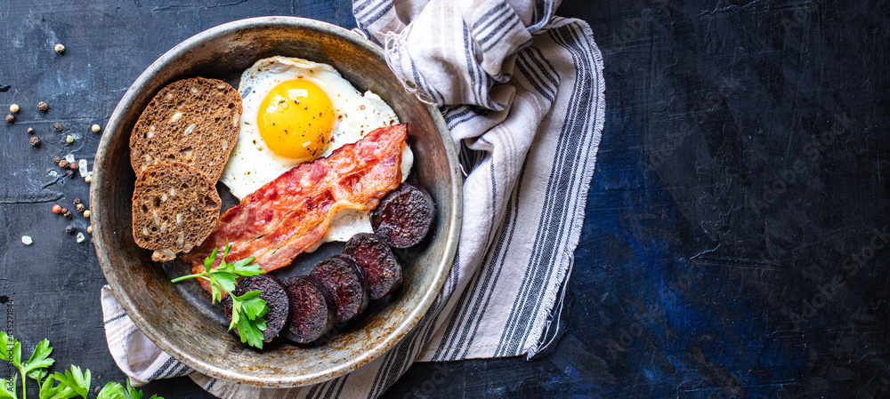 english breakfast fried egg fresh black pudding blood sausage, cereal  bread, beans, bacon, scrambled eggs food healthy meal snack copy space food  background rustic top view foto de Stock | Adobe Stock