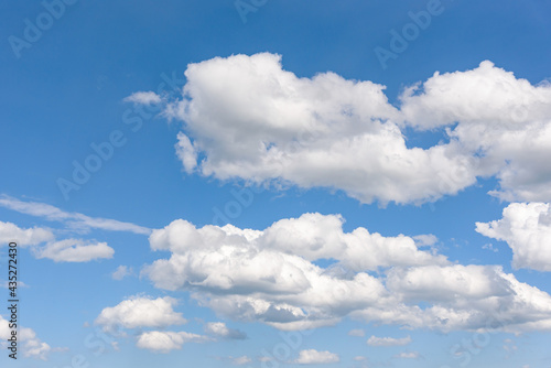 Clouds on the blue sky as natural background © mkos83