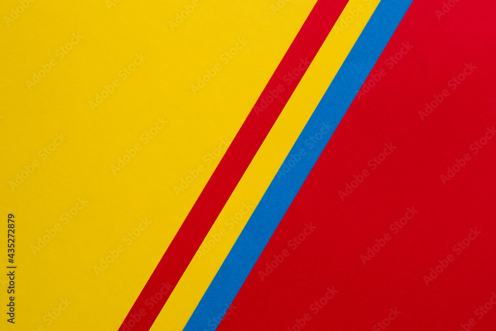 Yellow and red background divided diagonally with red, yellow and blue stripes Yellow and red background divided diagonally with red, yellow and blue stripes