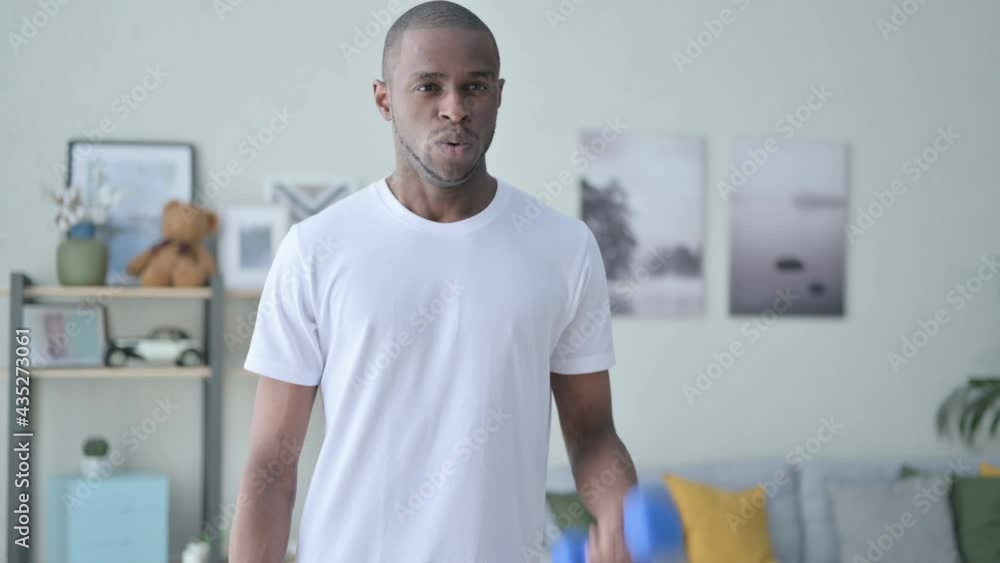 Close up of Athletic African Man Working out with Dumbbells Close up of Athletic African Man Working out with Dumbbells