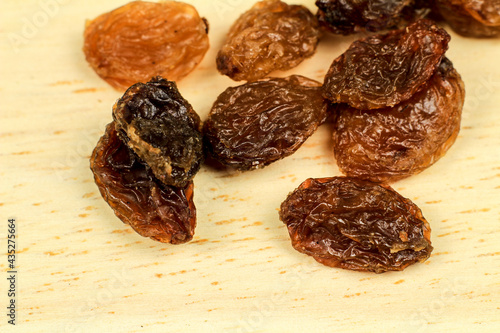 Wallpaper Mural Sultana raisins on brown wooden board Torontodigital.ca